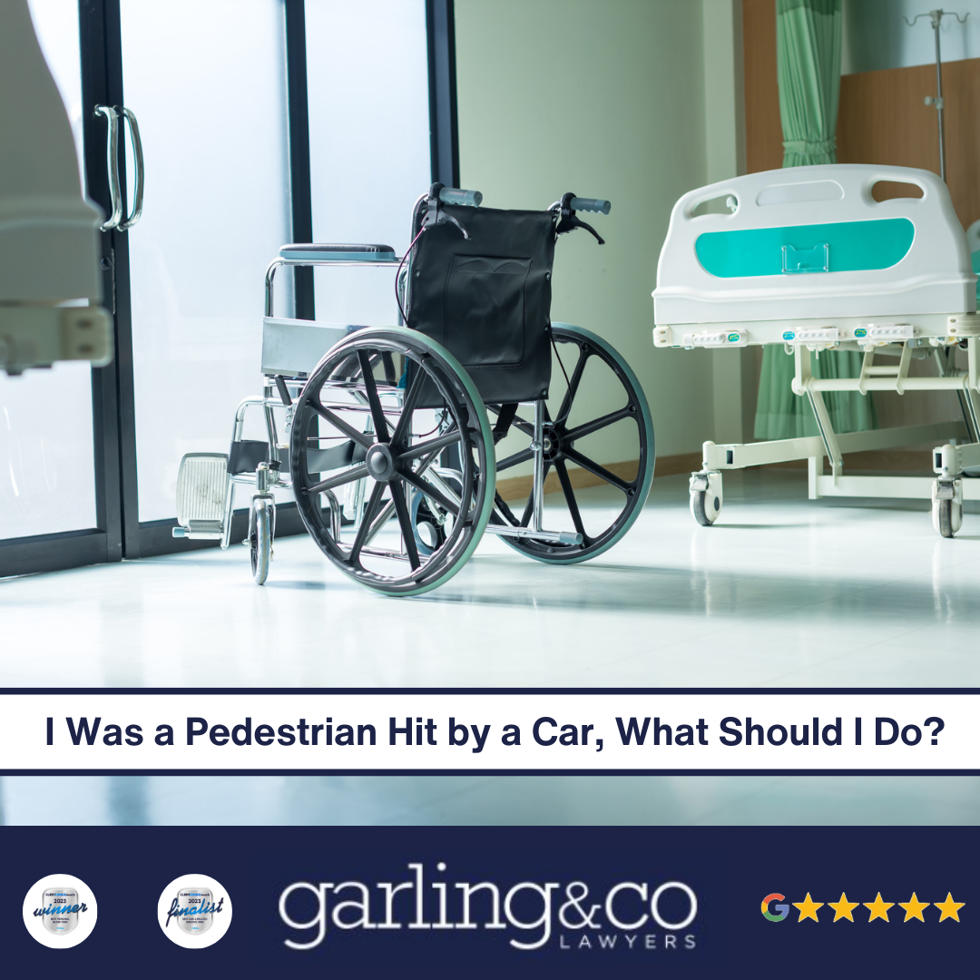 A hospital room with a wheelchair facing the door next to a hospital bed with the caption “I Was a Pedestrian Hit by a Car, What Should I Do”
