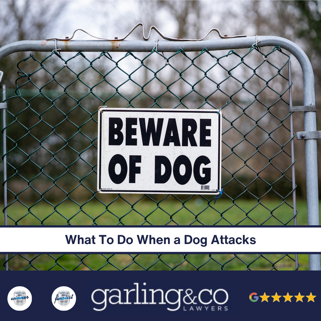 A sign on a gate which says "BEWARE OF DOG"