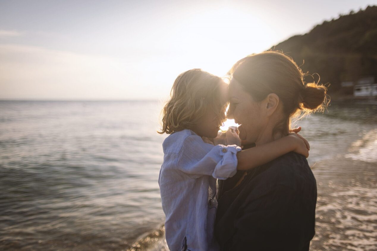 switching lawyers. mother and son at beach