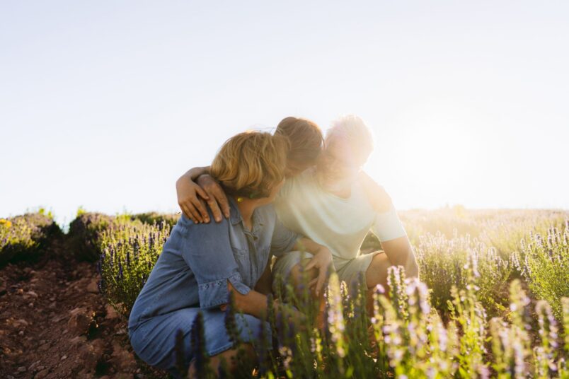 family in field in sunshine. Workers Compensation main image