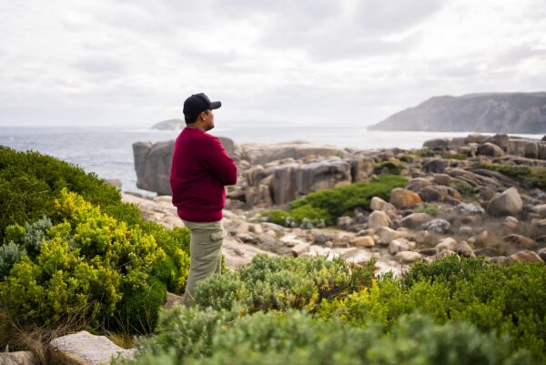 man standing on rocks