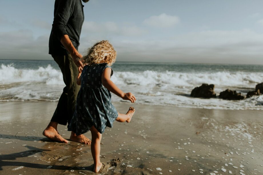 Daughter with father at beach. Public Liability main image