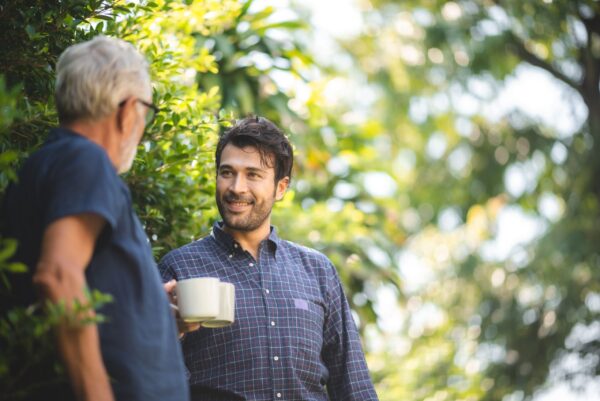 Father and son drinking coffee - construction