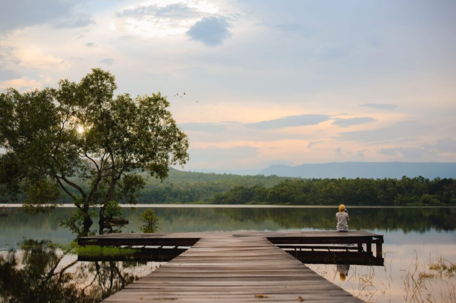 Women on bench near water. Medical expense