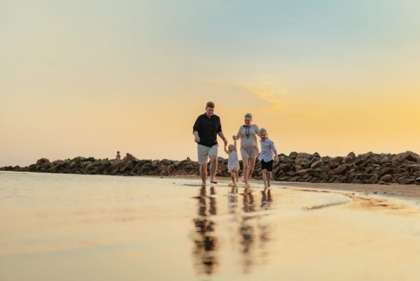 Family enjoying beach public liability
