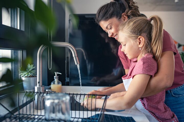 MOTHER AND DAUGHTER IN KITCHEN