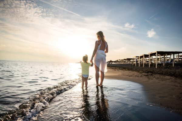 womens pain and birth trauma mother and child at the beach