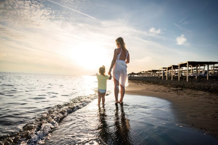 womens pain and birth trauma mother and child at the beach