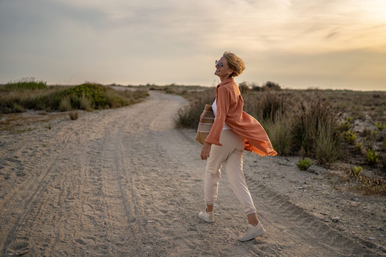 older lady at beach with Delayed diagnosis of cancer