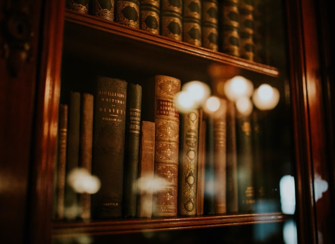 An old bookcase with books on it.